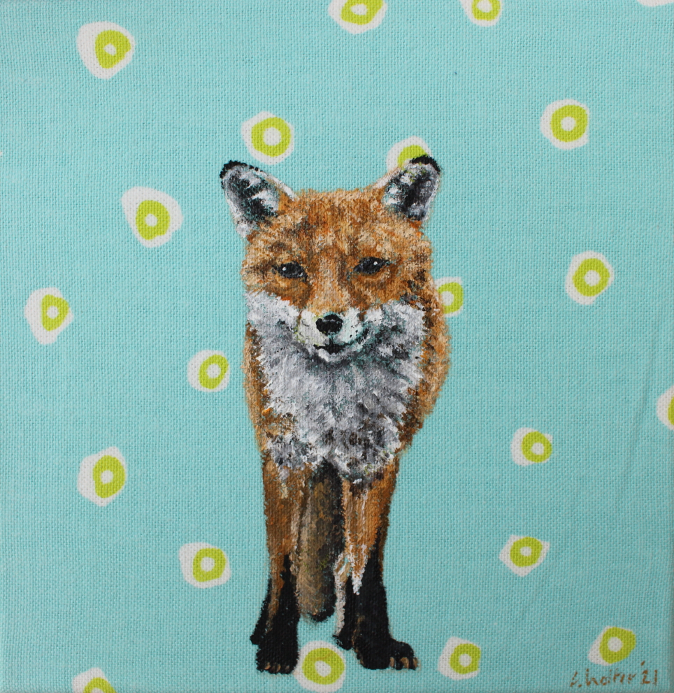 Stoffbild klein: Ein Fuchs, der den Betrachter ansieht. Er steht vor einem hellblauen Hintergrund mit großen weißen und grünen Tupfen.